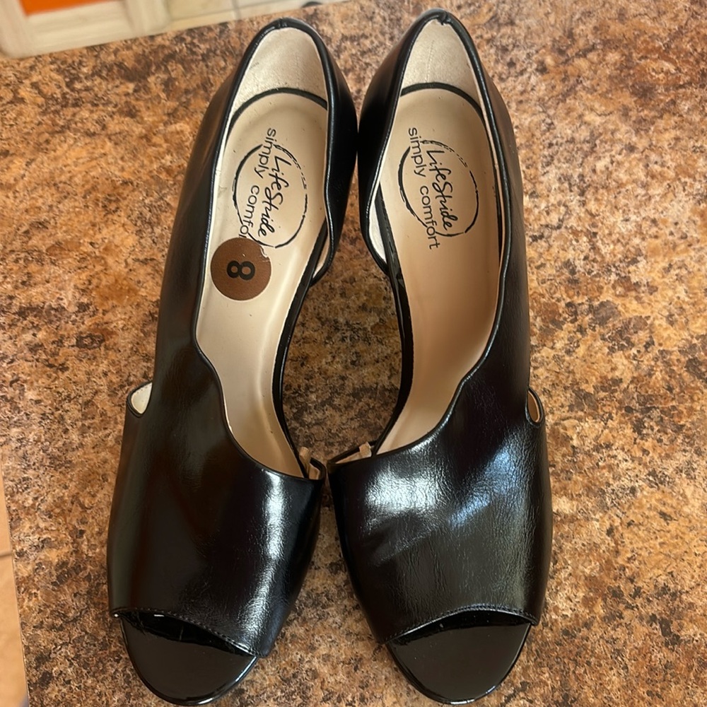 Black open toe shoes.